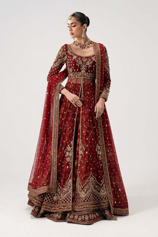Maria B Bazif full-length red bridal dress featuring intricate gold embroidery, voluminous flared Pishwas and ornate wedding wear borders