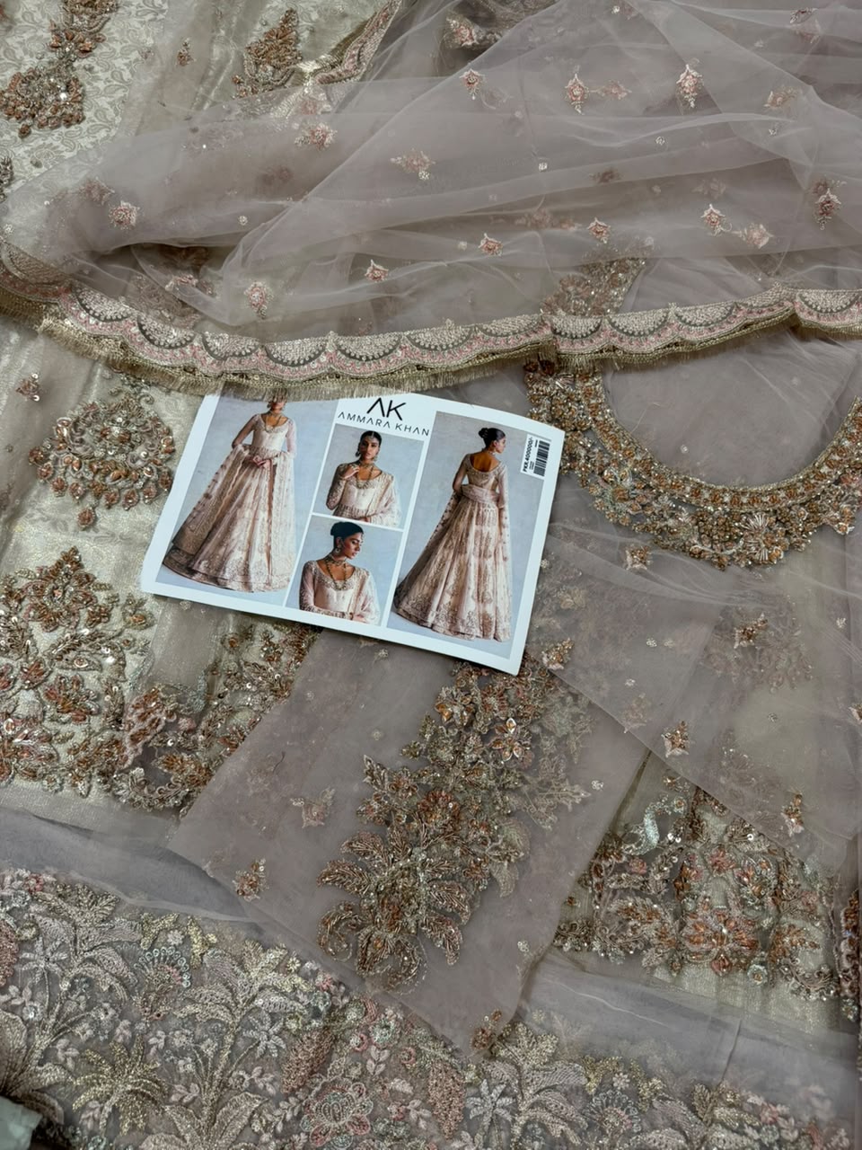 Ammara Khan Ivory Skin Bridal Peshwas Lehenga Maxi close-up featuring hand embellished neckline, zardozi embroidery, luxury net dupatta and Pakistani wedding dress by Nimz Collection
