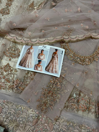 Ammara Khan Ivory Skin Bridal Peshwas Lehenga Maxi close-up featuring hand embellished neckline, zardozi embroidery, luxury net dupatta and Pakistani wedding dress by Nimz Collection
