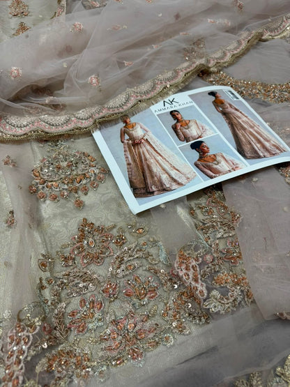 Luxury Pakistani bridal peshwas lehenga maxi in ivory skin with intricate zardozi, resham embroidery, embellished neckline and net dupatta by Ammara Khan