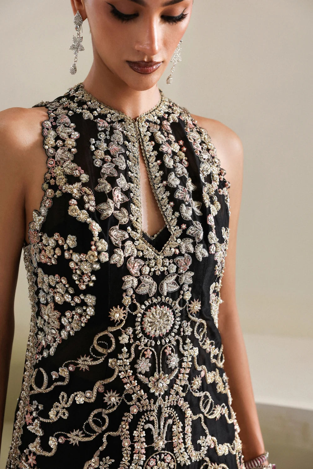 Close up of Kora Dabka pearl and jewel handwork on black Pakistani formal dress