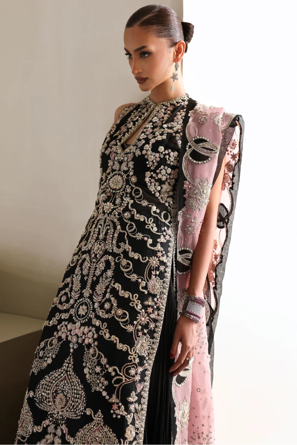 Black Pakistani designer dress with intricate hand embellishment on premium organza fabric