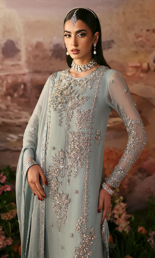Three-quarter view of an ice blue Nomi Ansari inspired chiffon formal dress with luxurious silver embroidery, perfect for Eid, wedding and party wear.