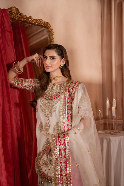 Pakistani formal dress with handcrafted Zardozi Naqshi work and red stone embellishment