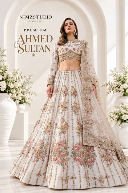 Full-length Ahmed Sultan ivory floral embroidered maxi lehenga with flowing skirt and embellished dupatta, luxury Pakistani wedding and Walima formal wear.