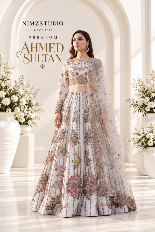 Ahmed Sultan Premium luxury Pakistani wedding maxi lehenga in ivory with floral embroidery, embellished dupatta and elegant bridal formal design at Nimzcollection.