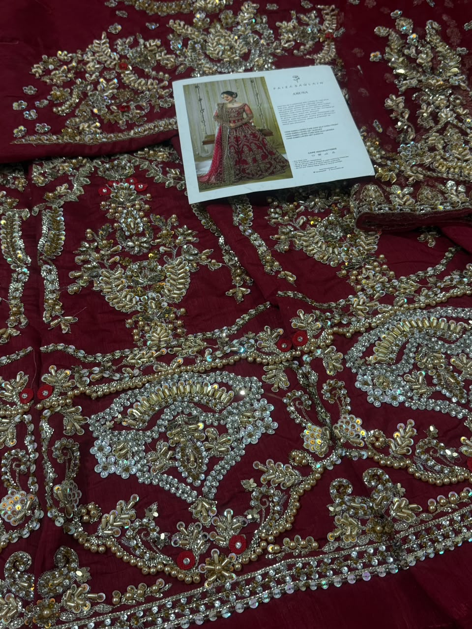 Intricate front embroidery of Faiza Saqlain Arusa bridal red raw silk maxi with floral hand embellishments.