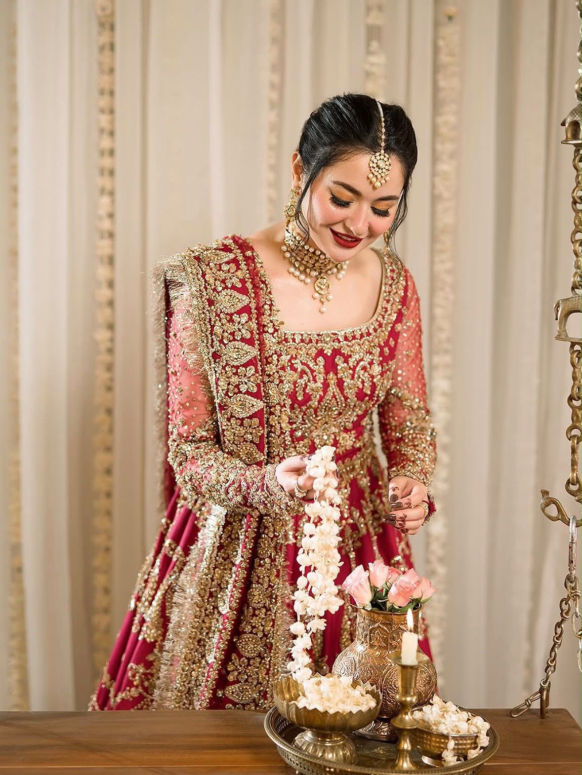 Close-up of Faiza Saqlain Arusa bridal maxi showcasing intricate neckline, crystal pearls and handmade embroidery.