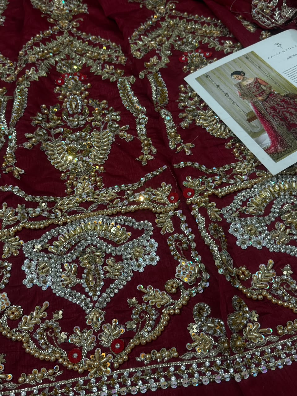 Floral handcrafted embroidery detail on Faiza Saqlain Arusa luxury Pakistani bridal raw silk dress.

