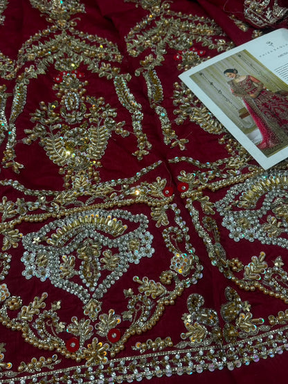 Floral handcrafted embroidery detail on Faiza Saqlain Arusa luxury Pakistani bridal raw silk dress.

