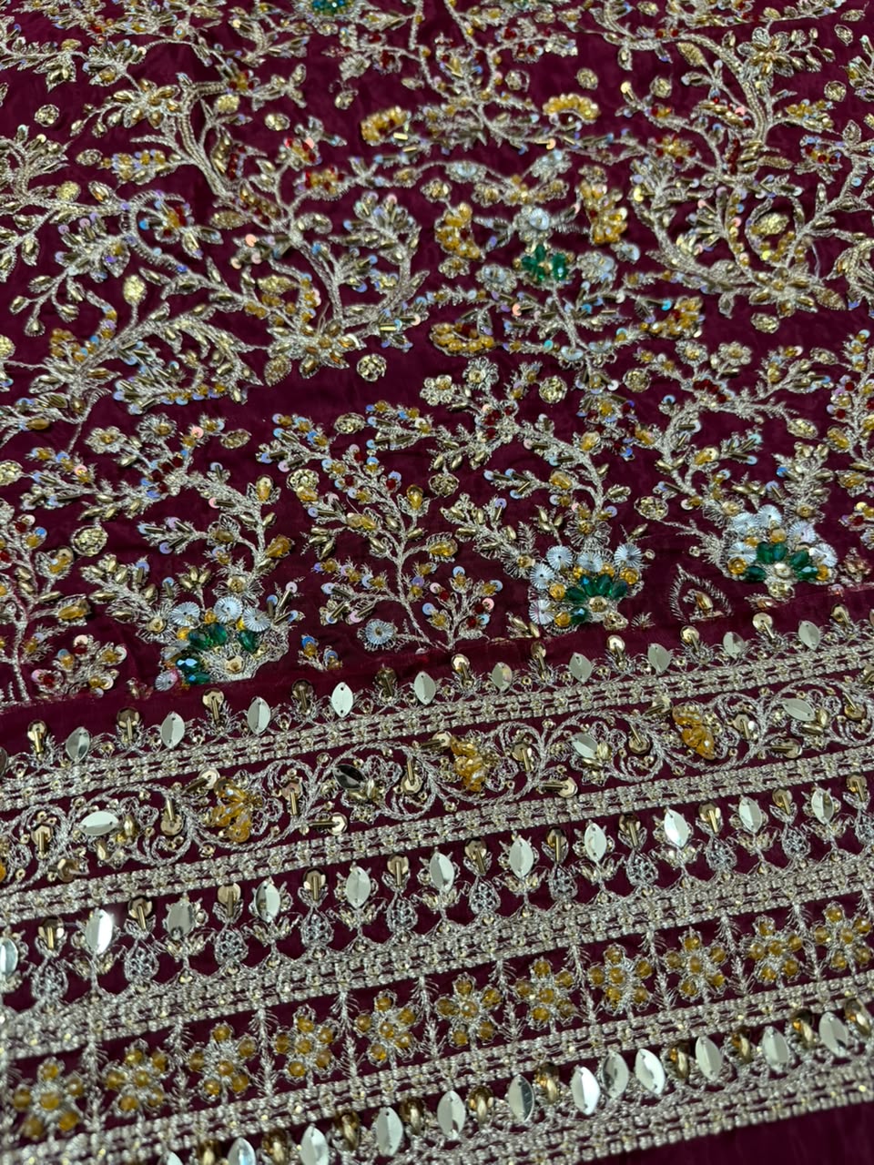 Luxury Haris Shakeel sharara border detail with handcrafted embroidery, mirror work and premium embellishments on a maroon Pakistani designer inspired bridal and party wear outfit.