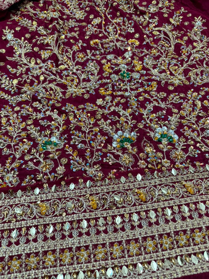 Close-up of Haris Shakeel maroon shirt daman featuring intricate hand embroidery, mirror embellishments, sequins and floral detailing on a luxury Pakistani designer inspired bridal sharara by Nimz Collection.
