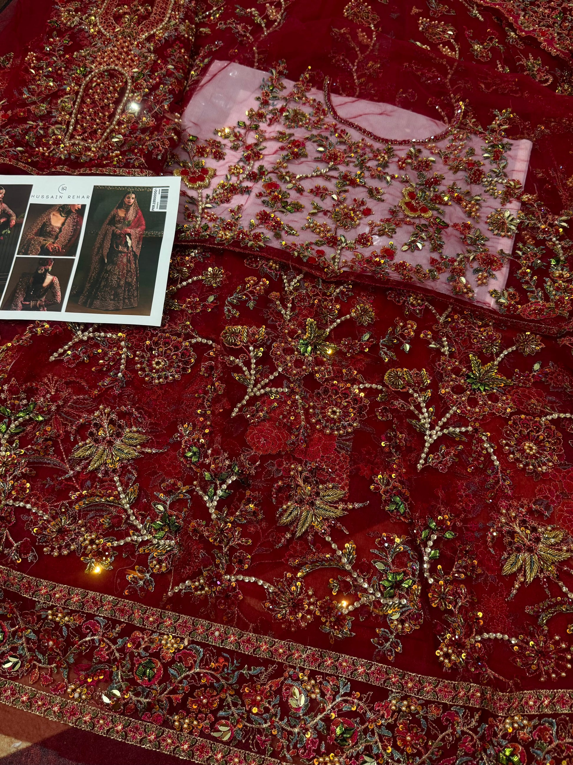 Detailed embroidery close-up of Hussain Rehar inspired bridal maxi featuring handcrafted zari work, floral embellishments, and premium Pakistani wedding dress craftsmanship.