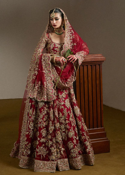 Full-length side profile of Hussain Rehar inspired maroon wedding partywear maxi with luxury embroidery, bridal dupatta, and couture craftsmanship for Pakistani weddings.