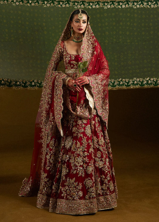 Hussain Rehar inspired maroon bridal wedding maxi featuring luxury hand embellishments, zari embroidery, bridal dupatta, and couture craftsmanship for Barat, Walima, Nikkah, and Pakistani wedding wear.