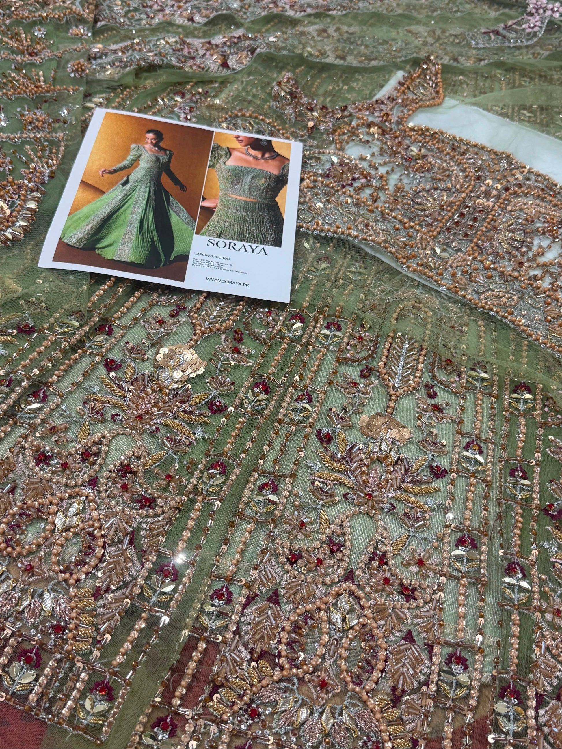 Close-up of Soraya Celvere Pakistani wedding partywear maxi featuring handcrafted embellishments, luxury crystal detailing, premium embroidery, and couture fabric craftsmanship.