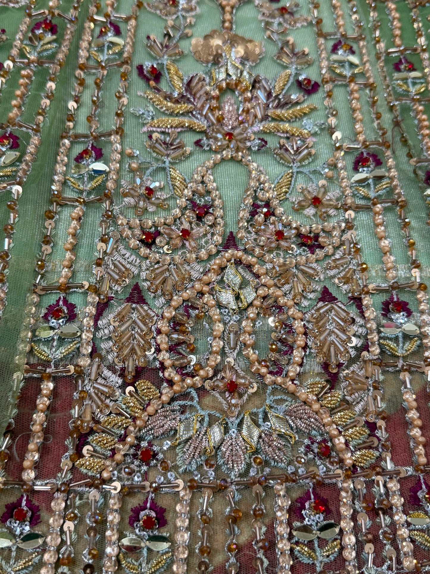 Detailed embroidery close-up of Soraya Celvere luxury Pakistani designer inspired maxi with hand embellishments, crystal stone work, premium craftsmanship, and elegant couture detailing.