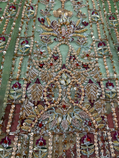 Detailed embroidery close-up of Soraya Celvere luxury Pakistani designer inspired maxi with hand embellishments, crystal stone work, premium craftsmanship, and elegant couture detailing.